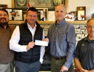 Gatlinburg, TN receives a donation from Veolia to its relief fund after a wildfire.