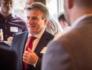 Veolia North America CEO Bill DiCroce in suit and red tie.
