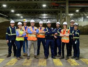 The Veolia team stands together in the CSTL facility